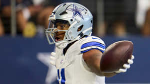 Dallas Cowboys Player Celebratingon Field Wallpaper