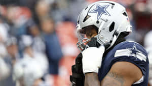 Dallas Cowboys Player Contemplative Moment Wallpaper