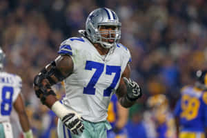 Dallas Cowboys Player77 In Action Wallpaper