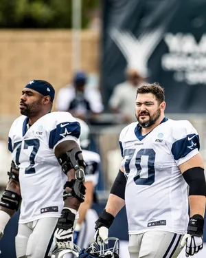 Dallas Cowboys Players Walking Off Field Wallpaper