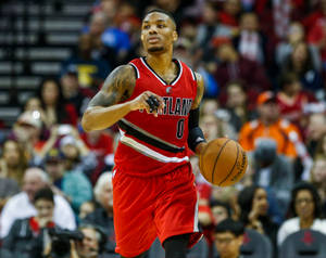 Damian Lillard In A Basketball Match Wallpaper