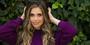 Danielle Fishel Posing With A Vibrant Background Wallpaper