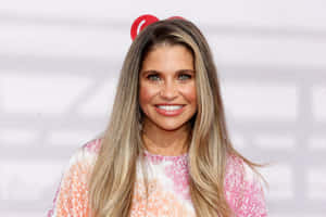 Danielle Fishel Smiling Radiantly At An Event Wallpaper