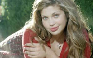 Danielle Fishel Smiling Radiantly In An Elegant Pose Wallpaper