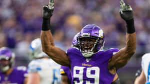 Danielle Hunter Raise Hands Celebrate Win Wallpaper