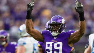 Danielle Hunter Raise Hands Celebrate Win Wallpaper