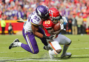 Danielle Hunter Tackling Tyreek Hill Wallpaper