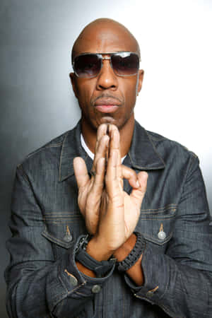 Dapper J.b. Smoove Striking A Pose In A Stylish Suit Wallpaper