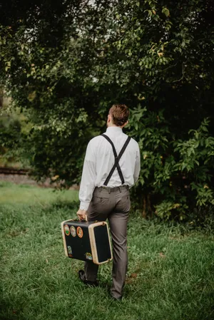 Dapper Look With Suspenders Wallpaper