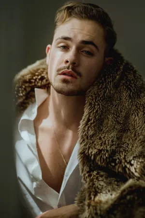 Dapper Manin Fur Coatand Open Shirt Wallpaper