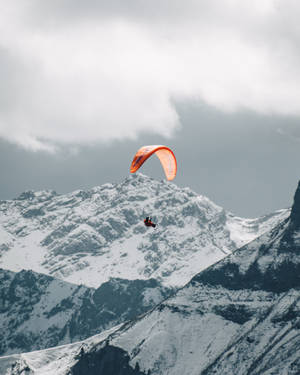 Daredevil Paraglider Soaring Through The Sky Wallpaper