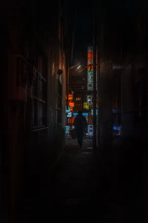 Dark_ Alley_with_ Illuminated_ Signs Wallpaper