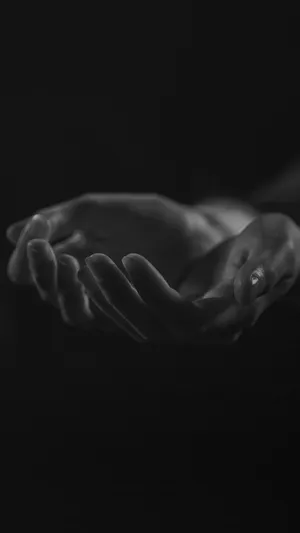 Dark Hand Emerging From The Shadows Wallpaper