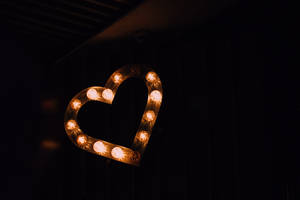 Dark Heart Made Of Light Bulbs Wallpaper