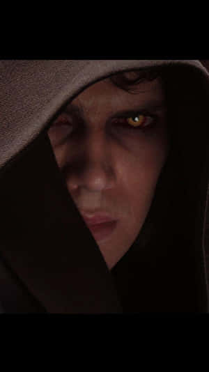 Dark Hooded Figurewith Yellow Eyes Wallpaper
