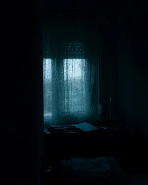 Dark Moody Roomwith Window Curtains Wallpaper