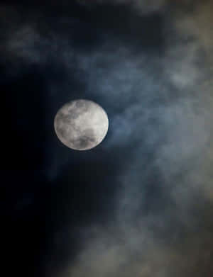 Dark Moon Illuminating The Night Sky Wallpaper