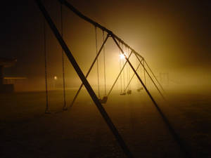 Dark Playground Swing Set Wallpaper