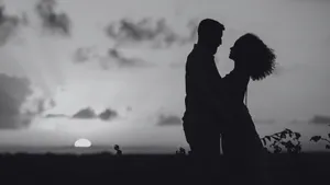 Dark Romance Sunset Embrace Wallpaper