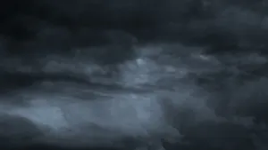 Dark Storm Approaching Over A Barren Landscape Wallpaper