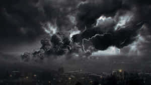 Dark Storm Looming Over A Mountain Landscape Wallpaper