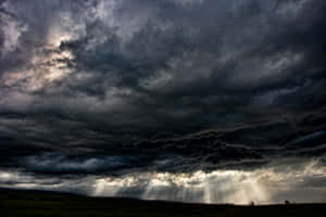 Dark Storm Rolling In Over Open Landscape Wallpaper