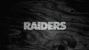 Dark Wooden Texture Raiders Text Wallpaper