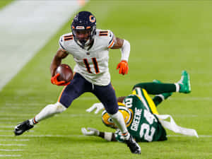 Darnell Mooney Evading Tackle During Game Wallpaper