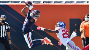 Darnell Mooney Makes A Leaping Catch Wallpaper