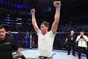 Darren Till Raising Arms In Victory Wallpaper