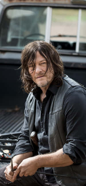Daryl Dixon Leaningon Truck Wallpaper
