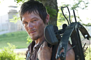 Daryl Dixon With Crossbow Outdoors Wallpaper