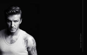 David Beckham Shows Off His Muscular Physique In A Black Tank Top Wallpaper