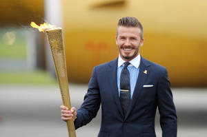 David Beckham Waves The Flag For Great Britain At The 2012 London Olympics Wallpaper