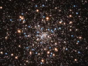 Dazzling Star Cluster In Vibrant Colors Wallpaper