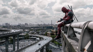 Deadpool Movie On A Guard Rail Wallpaper