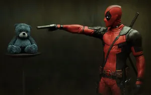 Deadpool Pointing His Gun At Teddy Wallpaper