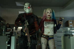 Deadshot And Harley Quinn In Epic Action Scene Wallpaper
