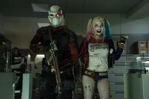 Deadshot And Harley Quinn In Epic Action Scene Wallpaper