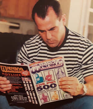 Dean Malenko Reading Wrestling Magazine Wallpaper