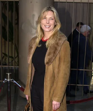 Deborah Kara Unger Smilingin Coat Wallpaper