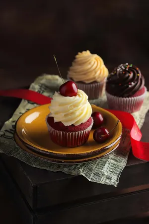 Decadent Cupcakeswith Cherries Wallpaper
