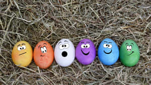 Decorated Easter Eggs Hanging From A Branch Wallpaper