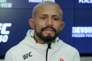 Deiveson Figueiredo In White Ufc Jacket Wallpaper