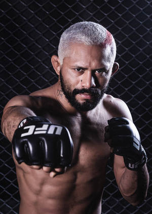 Deiveson Figueiredo Posing With Ufc Gloves Wallpaper