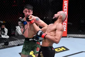 Deiveson Figueiredo Throwing A Powerful Punch Wallpaper