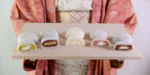 Delectable Assortment Of Japanese Sweets On Display Wallpaper