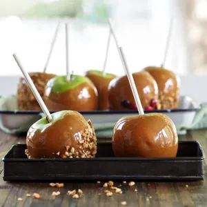 Delectable Caramel Apples On A Stick Wallpaper