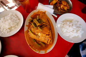 Delectable Fish Head Curry Served With Rice Wallpaper