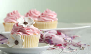 Delectable Pink Cupcakes On Display Wallpaper